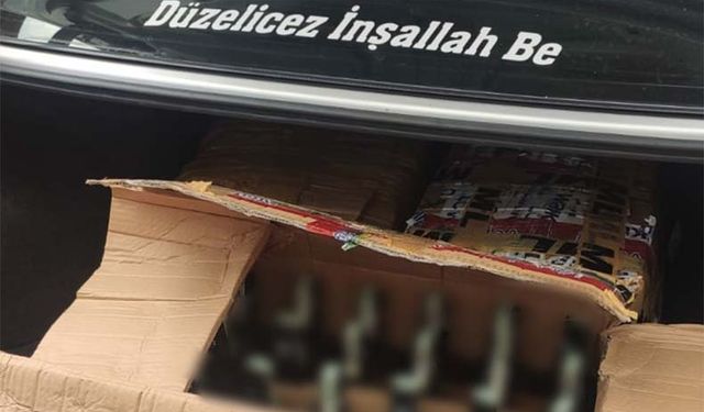 Camında "Düzelicez İnşallah be" yazan araçla kaçak içki taşırken yakalandı